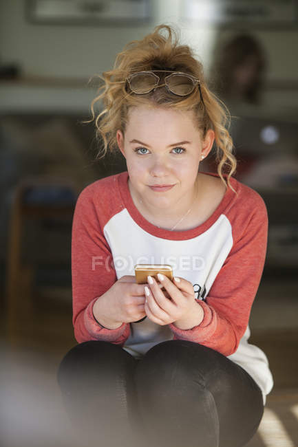 Teenage girl looking at camera, selective focus — Stock Photo