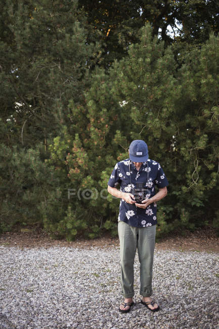 Man with camera in Sweden, focus on foreground — Stock Photo