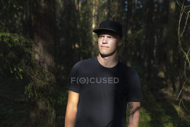 Young man in forest, selective focus — Stock Photo