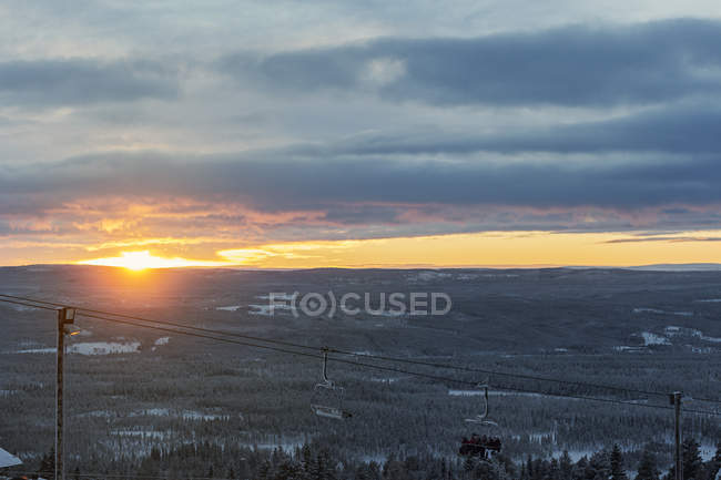 Ski lift at sunset, selective focus — Stock Photo