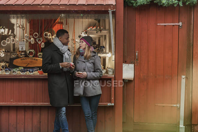 Couple drinking mulled wine, selective focus — Stock Photo