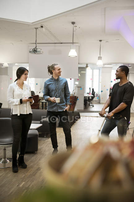 Coworkers talking in office, selective focus — Stock Photo