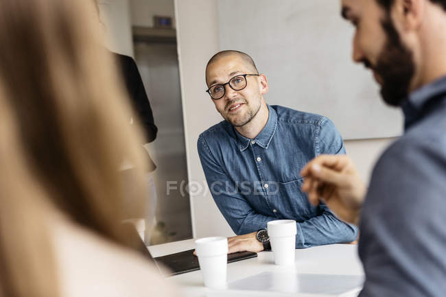 Businesspeople during meeting in conference room — Stock Photo