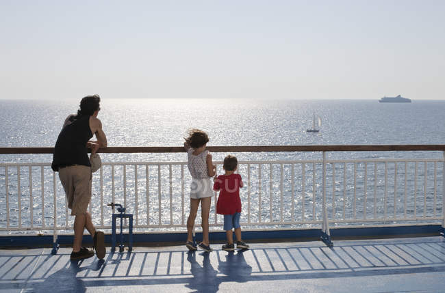 Man with children by sea, selective focus — Stock Photo