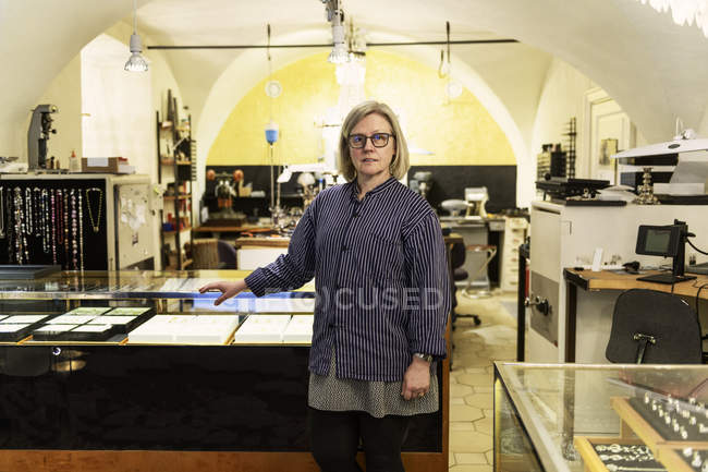 Goldsmith at counter of store, selective focus — Stock Photo
