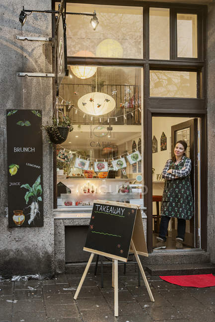 Cafe owner in doorway, selective focus — Stock Photo