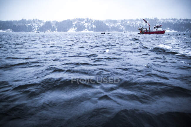 Fishing boat at sea in wintertime — Stock Photo