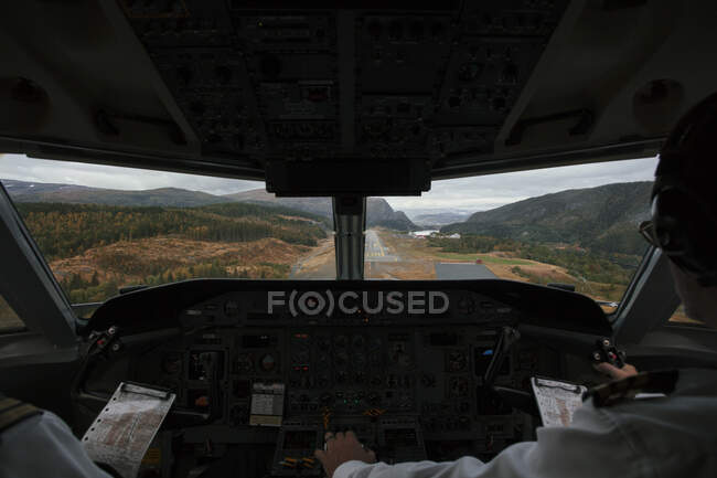 Pilots in cockpit back view — Stock Photo