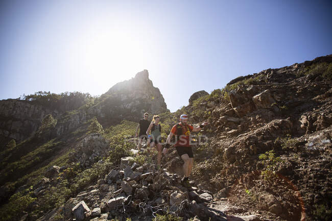 Hikers on mountain under sunshine — Stock Photo