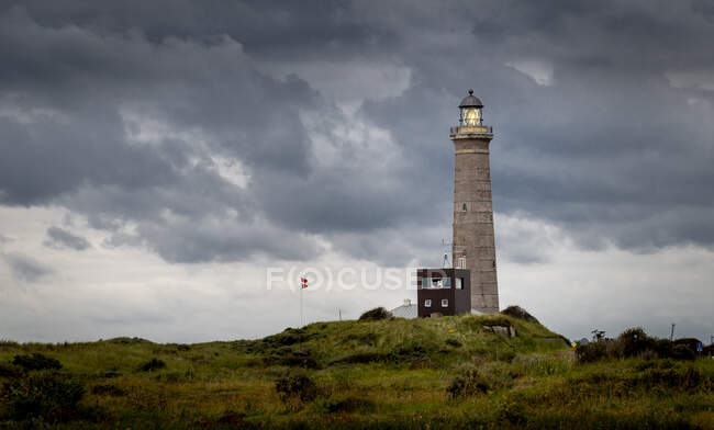 Lighthouse and overcast sky — Stock Photo