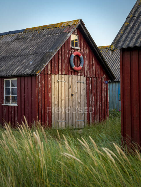 Fisherman's shack with life preserver — Stock Photo