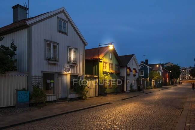 Houses on street at night — Stock Photo