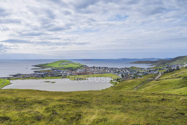 Hills and coastline under clouds — Stock Photo