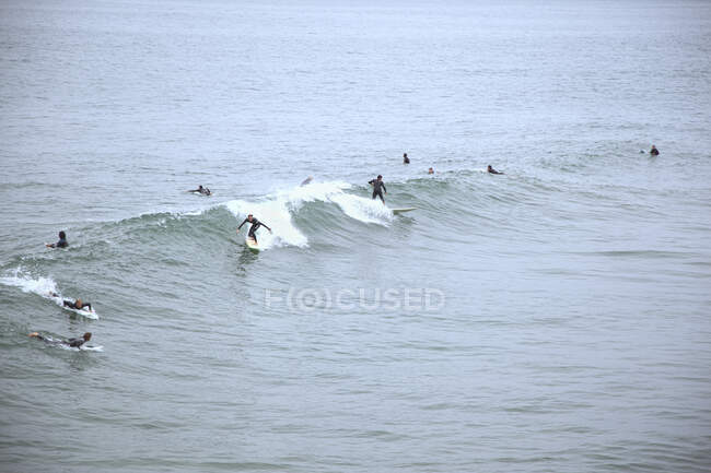 Surfers at Huntington Beach, California — стокове фото