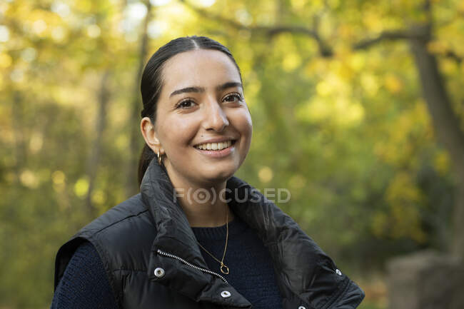 Portrait of young woman in forest — Stock Photo