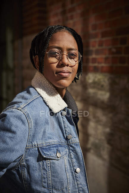 Teenage boy in glasses and denim jacket — Stock Photo