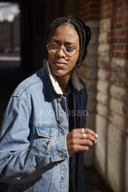 Teenage boy in glasses and denim jacket — Stock Photo