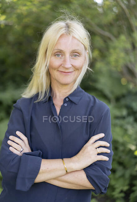 Portrait of mature woman in blue shirt — Stock Photo