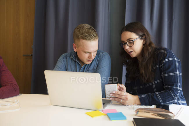 Coworkers talking in office conference room — Stock Photo