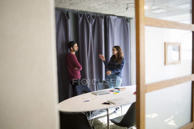Coworkers talking in office conference room — Stock Photo