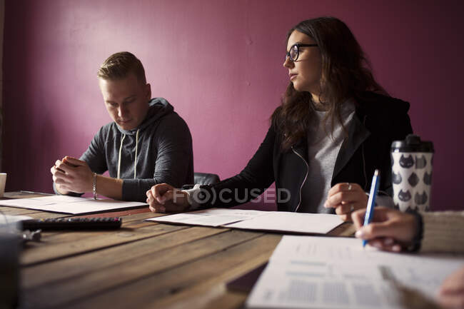 Coworkers at table during office meeting — Stock Photo