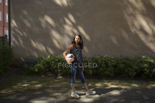 Portrait of girl holding ball — Stock Photo