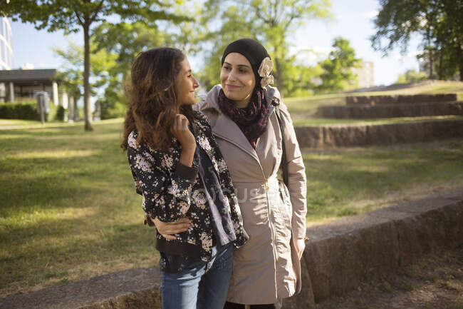 Woman and daughter in park — Stock Photo