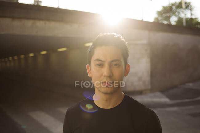 Portrait of young man at sunset — Stock Photo