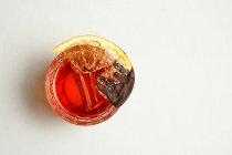 Top view of cocktail with slice of dried lemon — Stock Photo