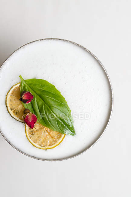 Top view of cocktail in metal glass with fruit decoration — Stock Photo