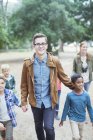 Students and teachers walking outdoors — Stock Photo