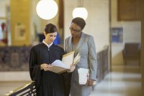 Judge and lawyer looking through documents — Stock Photo