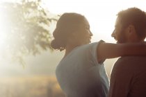 Couple hugging outdoors during daytime — Stock Photo
