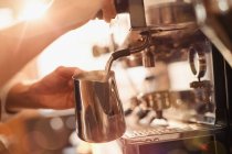 Close up barista using espresso machine milk frother — Stock Photo