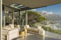 Sunny modern luxury home showcase balcony with mountain view — Stock Photo
