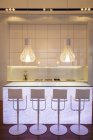 Bar stools in modern kitchen — Stock Photo