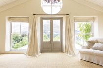 Curtains and front doors of rustic house — Stock Photo