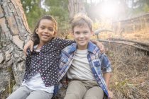 Children sitting together outdoors — Stock Photo