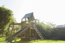 Play structure in backyard over grass — Stock Photo