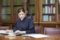 Judge doing research in chambers — Stock Photo