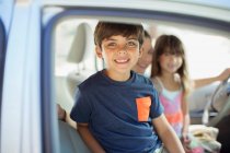 Portrait of smiling boy inside car — Stock Photo