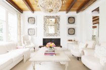 Luxury living room with chandelier — Stock Photo