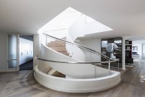 Modern spiral staircase in home showcase interior — Stock Photo