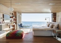 Sunny bedroom with ocean view — Stock Photo
