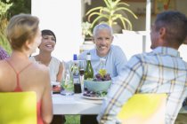 Friends eating together outdoors — Stock Photo