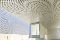 Illuminated window in modern office building — Stock Photo
