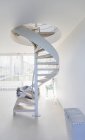 White spiral staircase in modern home showcase interior — Stock Photo