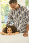 Portrait of smiling girl with father — Stock Photo