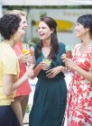 Women talking at party — Stock Photo