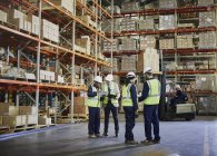 Workers meeting and talking in distribution warehouse — Stock Photo